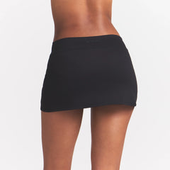 NikeSKIMS MATTE SKORT | NSKM OBSIDIAN ON A MODEL