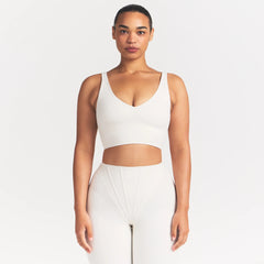 NikeSKIMS MATTE V-NECK BRA TOP | IVORY ON A MODEL