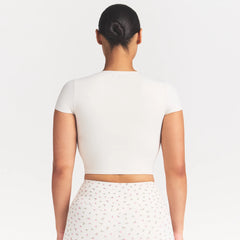 NikeSKIMS MATTE CORSET CROP TOP | IVORY ON A MODEL