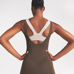 NikeSKIMS MATTE CORSET 29" ONE PIECE | DARK SEPIA ON A MODEL