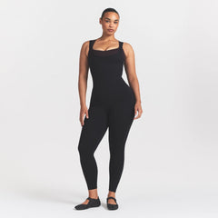 NikeSKIMS MATTE CORSET 29" ONE PIECE | OBSIDIAN ON A MODEL