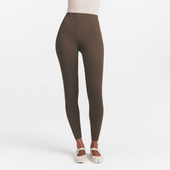 NikeSKIMS MATTE HIGH WAIST CORSET 26" LEGGING | DARK SEPIA ON A MODEL