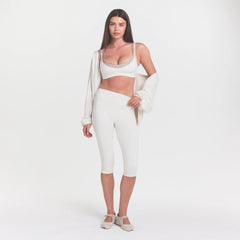 NikeSKIMS MATTE CROP 17" LEGGING | IVORY ON A MODEL