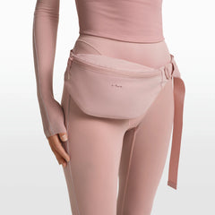 NikeSKIMS ACCESSORIES FANNY PACK | HIMALAYAN ON A MODEL FRONT VIEW @ | FOCUS: 0.0, 1.0, 0.9