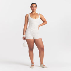 NikeSKIMS MATTE CORSET 2" ONE PIECE | DITSY FLORAL PRINT ON A MODEL @ | FOCUS: 0.0, 1.0, 0.9