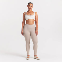 NikeSKIMS MATTE MICRO SCOOP BRA | DITSY FLORAL PRINT ON A MODEL