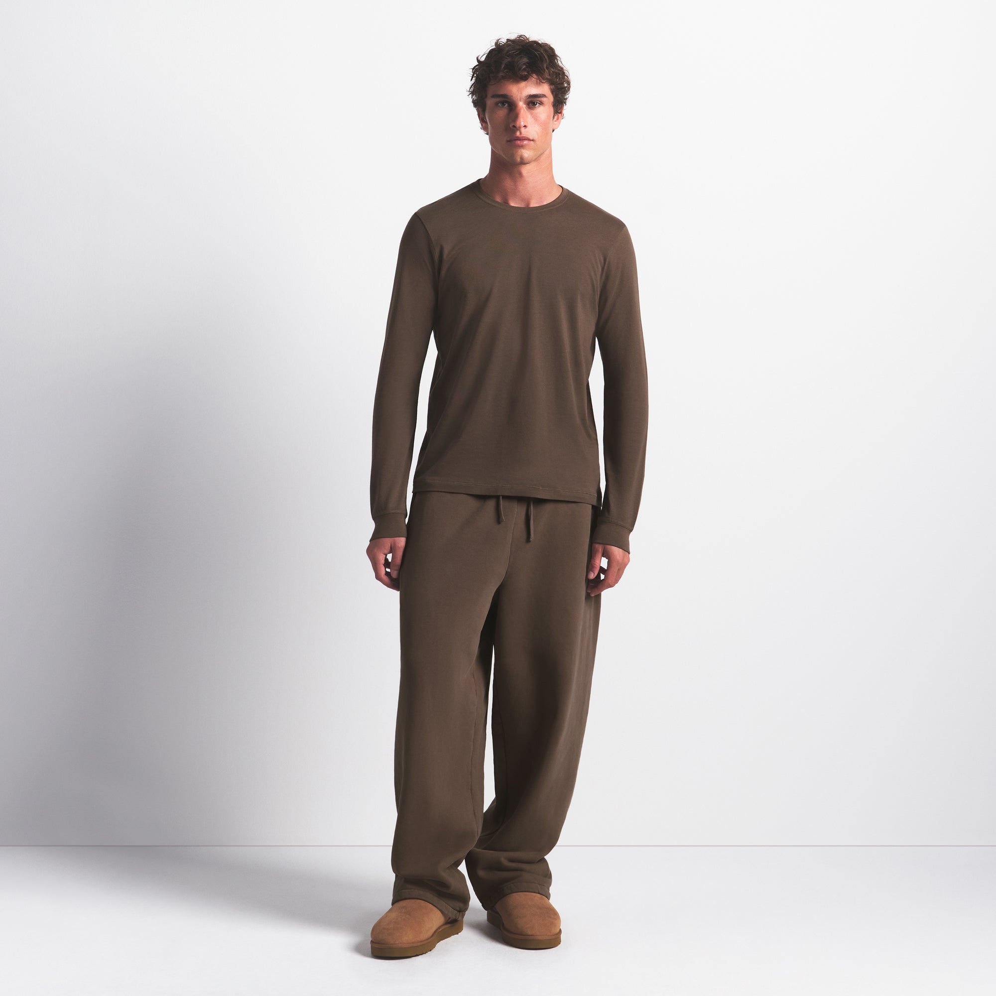 SKIMS COTTON MENS CLASSIC LONG SLEEVE T-SHIRT | DRIFTWOOD ON A MODEL FRONT VIEW @ | FOCUS: 0.0, 1.0, 0.9