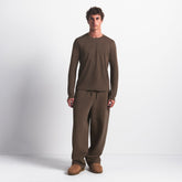SKIMS COTTON MENS CLASSIC LONG SLEEVE T-SHIRT | DRIFTWOOD ON A MODEL FRONT VIEW @ | FOCUS: 0.0, 1.0, 0.9