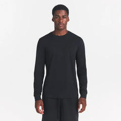 SKIMS COTTON MENS CLASSIC LONG SLEEVE T-SHIRT | ONYX ON A MODEL FRONT VIEW