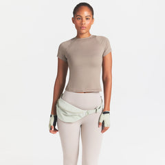 NikeSKIMS ACCESSORIES FANNY PACK | TALC ON A MODEL SIDE VIEW @ | FOCUS: 0.0, 1.0, 0.9