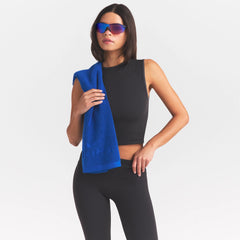 NikeSKIMS ACCESSORIES SMALL TOWEL | COBALT ON A MODEL SIDE VIEW @ | FOCUS: 0.0, 1.0, 0.9