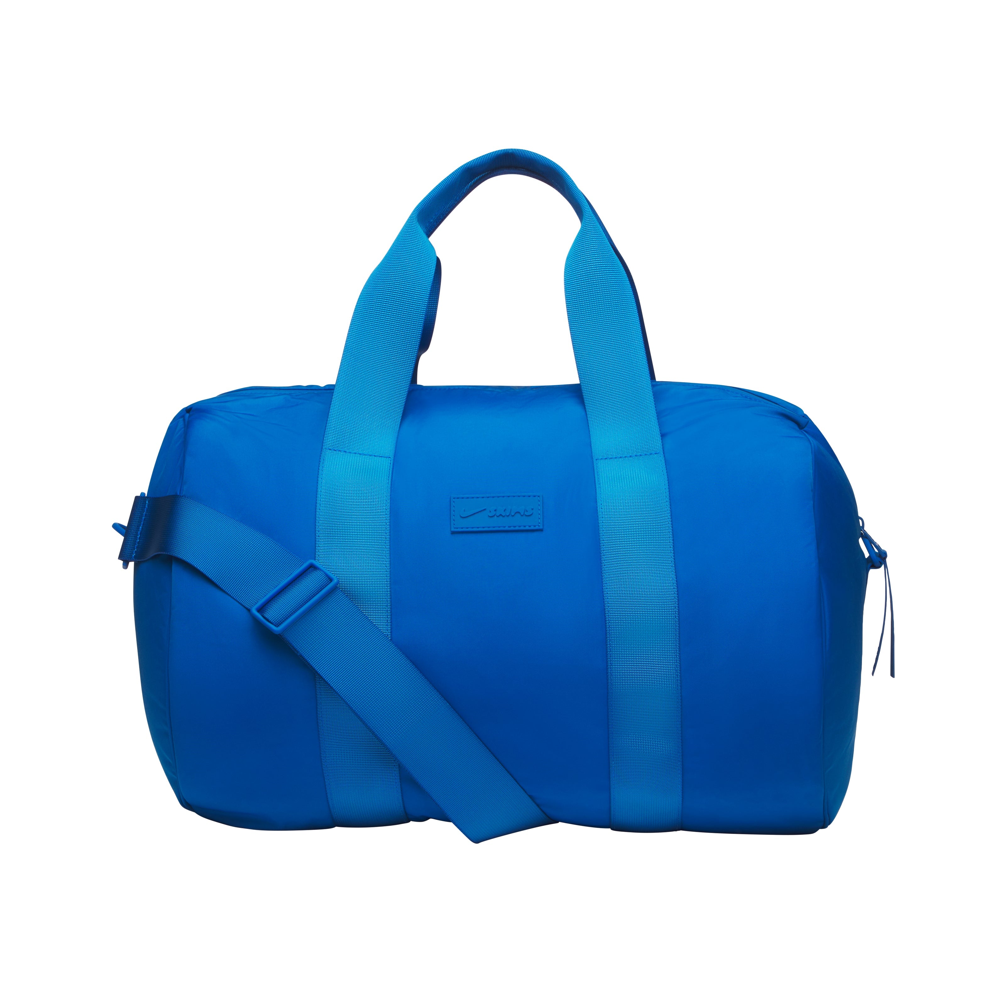 NikeSKIMS ACCESSORIES PUFFER GYM BAG | COBALT & LAYS FLAT ON A WHITE BACKGROUND | FLT