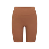 NikeSKIMS MATTE 7" BIKER SHORT | CAROB BROWN FLAT ON A WHITE BACKGROUND | FLT