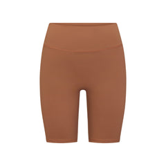 NikeSKIMS MATTE 7" BIKER SHORT | CAROB BROWN FLAT ON A WHITE BACKGROUND | FLT