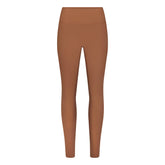 NikeSKIMS MATTE 26" LEGGING | CAROB BROWN FLAT ON A WHITE BACKGROUND | FLT