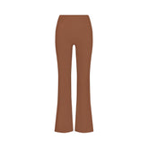 NikeSKIMS MATTE SLIM FLARE LEGGING | CAROB BROWN FLAT ON A WHITE BACKGROUND | FLT