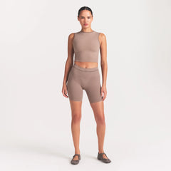NikeSKIMS RIBBED SEAMLESS 5" BIKER SHORT | DRIFTWOOD ON A MODEL FRONT VIEW @ | FOCUS: 0.0, 1.0, 0.9