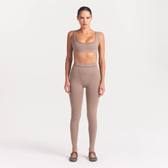 NikeSKIMS RIBBED SEAMLESS 26" LEGGING | DRIFTWOOD ON A MODEL FRONT VIEW @ | FOCUS: 0.0, 1.0, 0.9