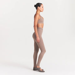 NikeSKIMS RIBBED SEAMLESS 26" LEGGING | DRIFTWOOD ON A MODEL FRONT VIEW @ | FOCUS: 0.0, 1.0, 0.9