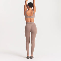 NikeSKIMS RIBBED SEAMLESS 26" LEGGING | DRIFTWOOD ON A MODEL FRONT VIEW @ | FOCUS: 0.0, 1.0, 0.9