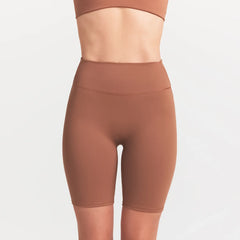 NikeSKIMS MATTE 7" BIKER SHORT | CAROB BROWN ON A MODEL SIDE VIEW @ | FOCUS: 0.0, 1.0, 0.9