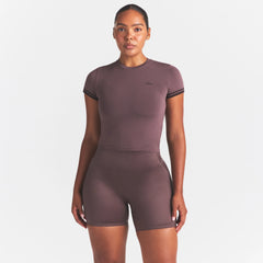NikeSKIMS SATIN SHINE BONDED WAIST 5" BIKER SHORT | RESIN ON A MODEL SIDE VIEW