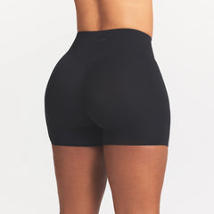 NikeSKIMS STUDIO STRETCH 5" BIKER SHORT | OBSIDIAN ON A MODEL SIDE VIEW @ | FOCUS: 0.0, 1.0, 0.9
