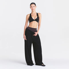 NikeSKIMS STRETCH KNIT WIDE LEG PANT | OBSIDIAN ON A MODEL FRONT VIEW @ | FOCUS: 0.0, 1.0, 0.9