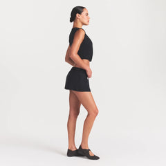 NikeSKIMS STRETCH NYLON SKORT | OBSIDIAN ON A MODEL FRONT VIEW