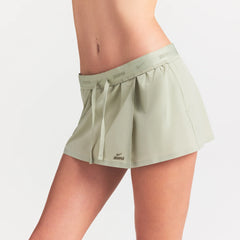 NikeSKIMS STRETCH NYLON SKORT | TALC ON A MODEL SIDE VIEW @ | FOCUS: 0.0, 1.0, 0.9