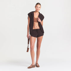 NikeSKIMS STRETCH NYLON RUNNER SHORT | DARK ROAST ON A MODEL FRONT VIEW @ | FOCUS: 0.0, 1.0, 0.9