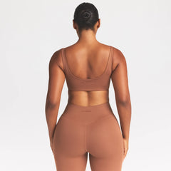 NikeSKIMS MATTE SCOOP NECK BRA | CAROB BROWN ON A MODEL SIDE VIEW @ | FOCUS: 0.0, 1.0, 0.9
