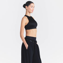 NikeSKIMS SATIN SHINE HIGH NECK BRA | OBSIDIAN ON A MODEL SIDE VIEW @ | FOCUS: 0.0, 1.0, 0.9