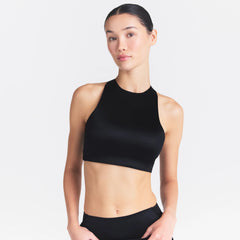 NikeSKIMS SATIN SHINE HIGH NECK BRA | OBSIDIAN ON A MODEL SIDE VIEW @ | FOCUS: 0.0, 1.0, 0.9