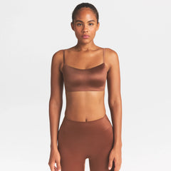 NikeSKIMS SATIN SHINE SCOOP CAMI BRA | CAROB BROWN ON A MODEL SIDE VIEW @ | FOCUS: 0.0, 1.0, 0.9