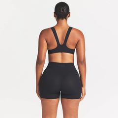 NikeSKIMS STUDIO STRETCH RACERBACK BRA | OBSIDIAN ON A MODEL SIDE VIEW @ | FOCUS: 0.0, 1.0, 0.9