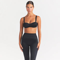 NikeSKIMS SATIN SHINE PANELED PICOT BRA | OBSIDIAN ON A MODEL SIDE VIEW @ | FOCUS: 0.0, 1.0, 0.9