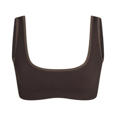NikeSKIMS RIBBED SEAMLESS MICRO SCOOP BRA | PHOENIX FLAT ON A WHITE BACKGROUND | FLT
