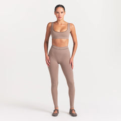 NikeSKIMS RIBBED SEAMLESS MICRO SCOOP BRA | DRIFTWOOD ON A MODEL FRONT VIEW @ | FOCUS: 0.0, 1.0, 0.9