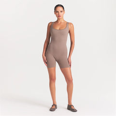NikeSKIMS RIBBED SEAMLESS SCOOP 5" ONE PIECE | DRIFTWOOD ON A MODEL FRONT VIEW @ | FOCUS: 0.0, 1.0, 0.9