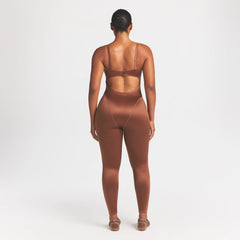 NikeSKIMS SATIN SHINE PANELED 26" ONE PIECE | CAROB BROWN ON A MODEL FRONT VIEW @ | FOCUS: 0.0, 1.0, 0.9