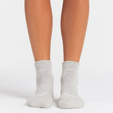 NikeSKIMS ACCESSORIES DRI-FIT™ ANKLE SOCK 3-PACK | SNOW(OBSIDIAN)/HEATHER GREY(SNOW)/OBSIDIAN(DARK SEPIA) ON A MODEL SIDE VIEW @ | FOCUS: 0.0, 1.0, 0.9