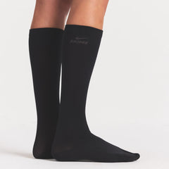 NikeSKIMS ACCESSORIES RIFT KNEE HIGH SOCK | OBSIDIAN/BOULDER ON A MODEL SIDE VIEW @ | FOCUS: 0.0, 1.0, 0.9