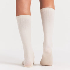 NikeSKIMS ACCESSORIES RIFT KNEE HIGH SOCK | LIGHT OREWOOD BROWN ON A MODEL SIDE VIEW @ | FOCUS: 0.0, 1.0, 0.9