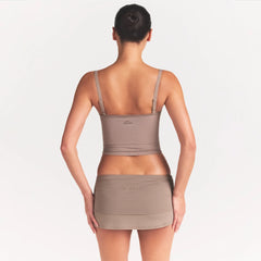 NikeSKIMS RIBBED SEAMLESS CAMI | DRIFTWOOD ON A MODEL SIDE VIEW @ | FOCUS: 0.0, 1.0, 0.9