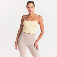 NikeSKIMS RIBBED SEAMLESS CAMI | LEMON DROP ON A MODEL SIDE VIEW @ | FOCUS: 0.0, 1.0, 0.9