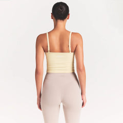 NikeSKIMS RIBBED SEAMLESS CAMI | LEMON DROP ON A MODEL SIDE VIEW @ | FOCUS: 0.0, 1.0, 0.9