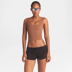 NikeSKIMS MATTE DOUBLE STRAP SCOOP TANK | CAROB BROWN ON A MODEL SIDE VIEW @ | FOCUS: 0.0, 1.0, 0.9