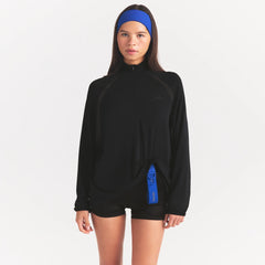 NikeSKIMS STRETCH KNIT LONG SLEEVE HALF ZIP | OBSIDIAN ON A MODEL SIDE VIEW @ | FOCUS: 0.0, 1.0, 0.9