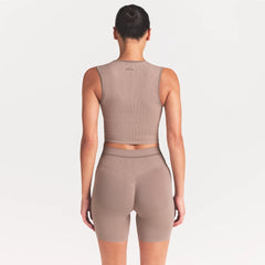 NikeSKIMS RIBBED SEAMLESS MUSCLE TANK | DRIFTWOOD ON A MODEL SIDE VIEW @ | FOCUS: 0.0, 1.0, 0.9